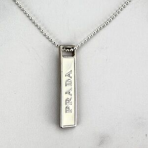 Prada charm w/bonus gift. AUTHENTIC White and silver.